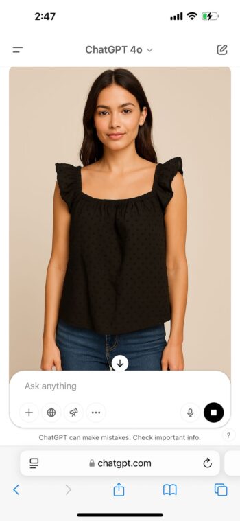 black sleeveless top featuring a square neckline, subtle textured polka dots, and ruffled shoulder straps. It has a relaxed fit for a casual and comfortable look.