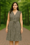 sleeveless knee-length dress featuring a bold geometric cube print in shades of brown, white, and light blue.