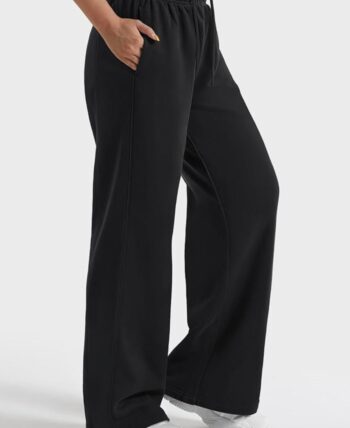 Woman’s black baggy sweatpants uncuffed