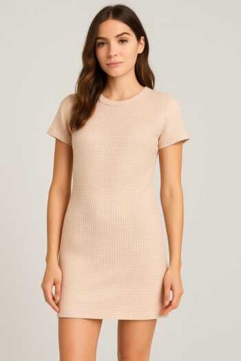 This is a casual beige waffle knit mini dress designed with a soft, textured fabric that adds a cozy and relaxed feel.