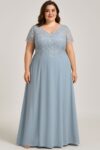 This elegant light blue gown features delicate lace detailing on the bodice and sleeves, paired with a smooth, flowing floor-length skirt.