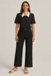2-piece black set featuring a short-sleeve button-up blouse with puffed sleeves