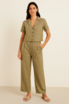 An olive-green two-piece set featuring a cropped button-up shirt and high-waisted wide-leg