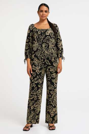 two-piece set featuring a black base with beige floral patterns.